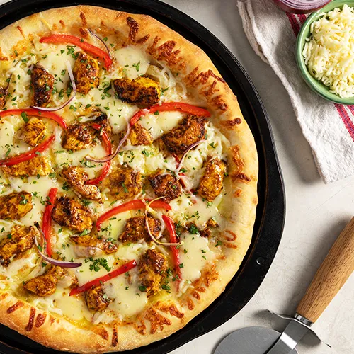 Butter Chicken Pizza - Casablanca Pizza and Donair Edmonton